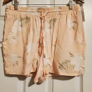 Tan, green, and white flower shorts